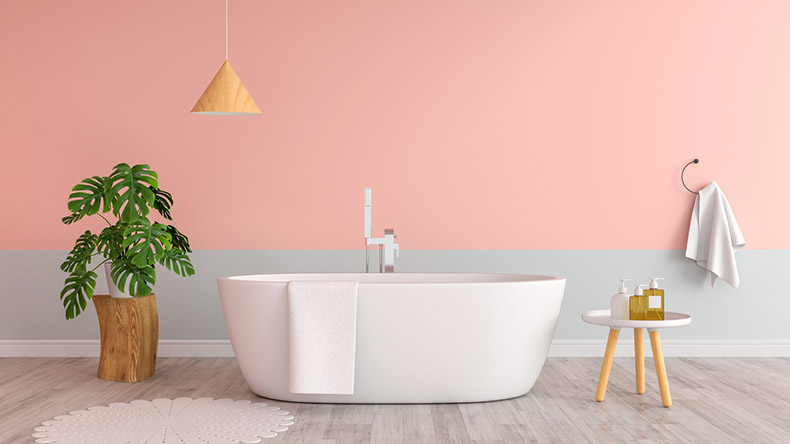 pink bathroom with white bath